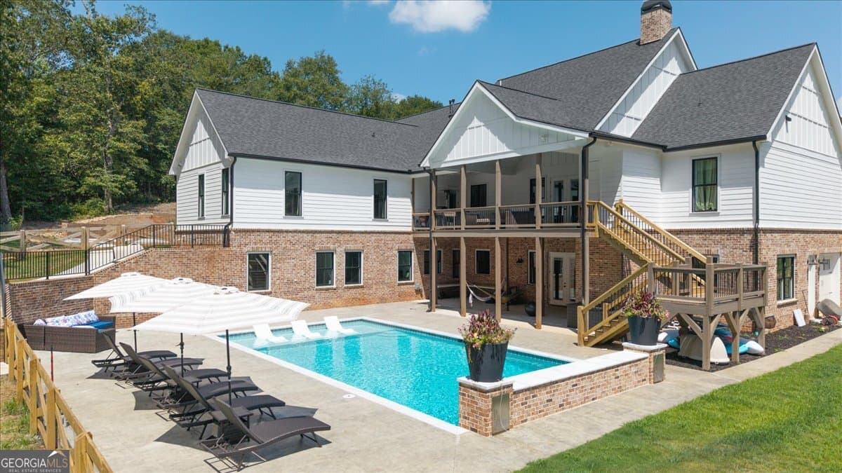 7 bedroom, 5.5 bathroom, 6,399 sq ft single family residence for sale at 1380 Cronic Town Road, Auburn, GA 30011 — photo 2