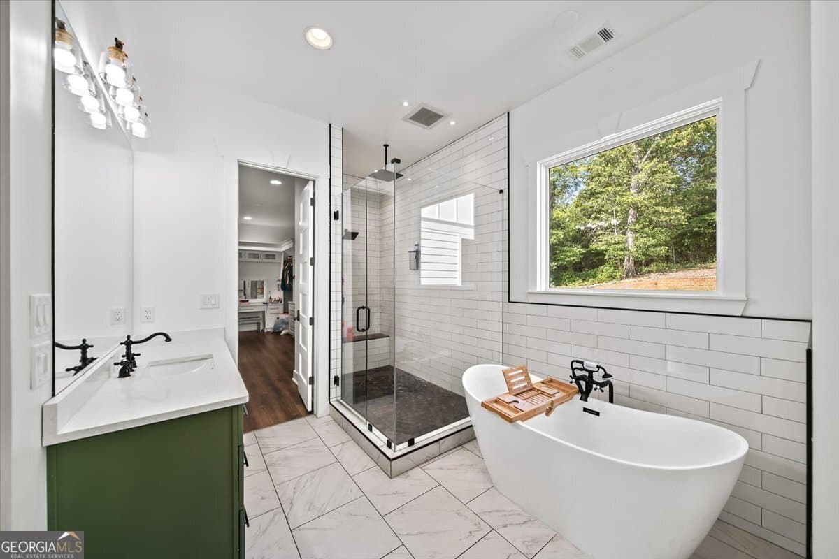 7 bedroom, 5.5 bathroom, 6,399 sq ft single family residence for sale at 1380 Cronic Town Road, Auburn, GA 30011 — photo 7