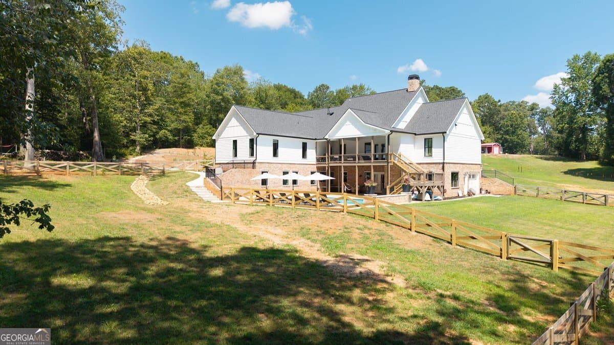 7 bedroom, 5.5 bathroom, 6,399 sq ft single family residence for sale at 1380 Cronic Town Road, Auburn, GA 30011 — photo 3