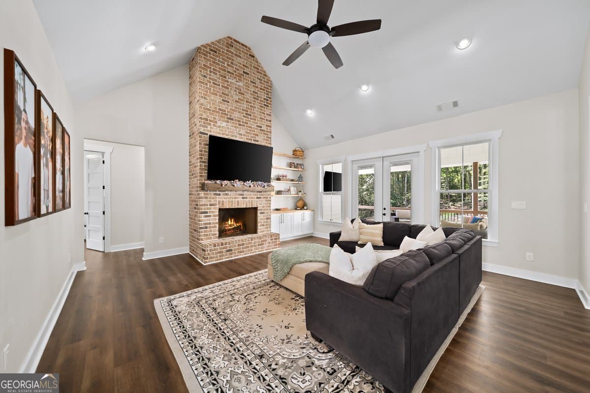 7 bedroom, 5.5 bathroom, 6,399 sq ft single family residence for sale at 1380 Cronic Town Road, Auburn, GA 30011 — photo 5