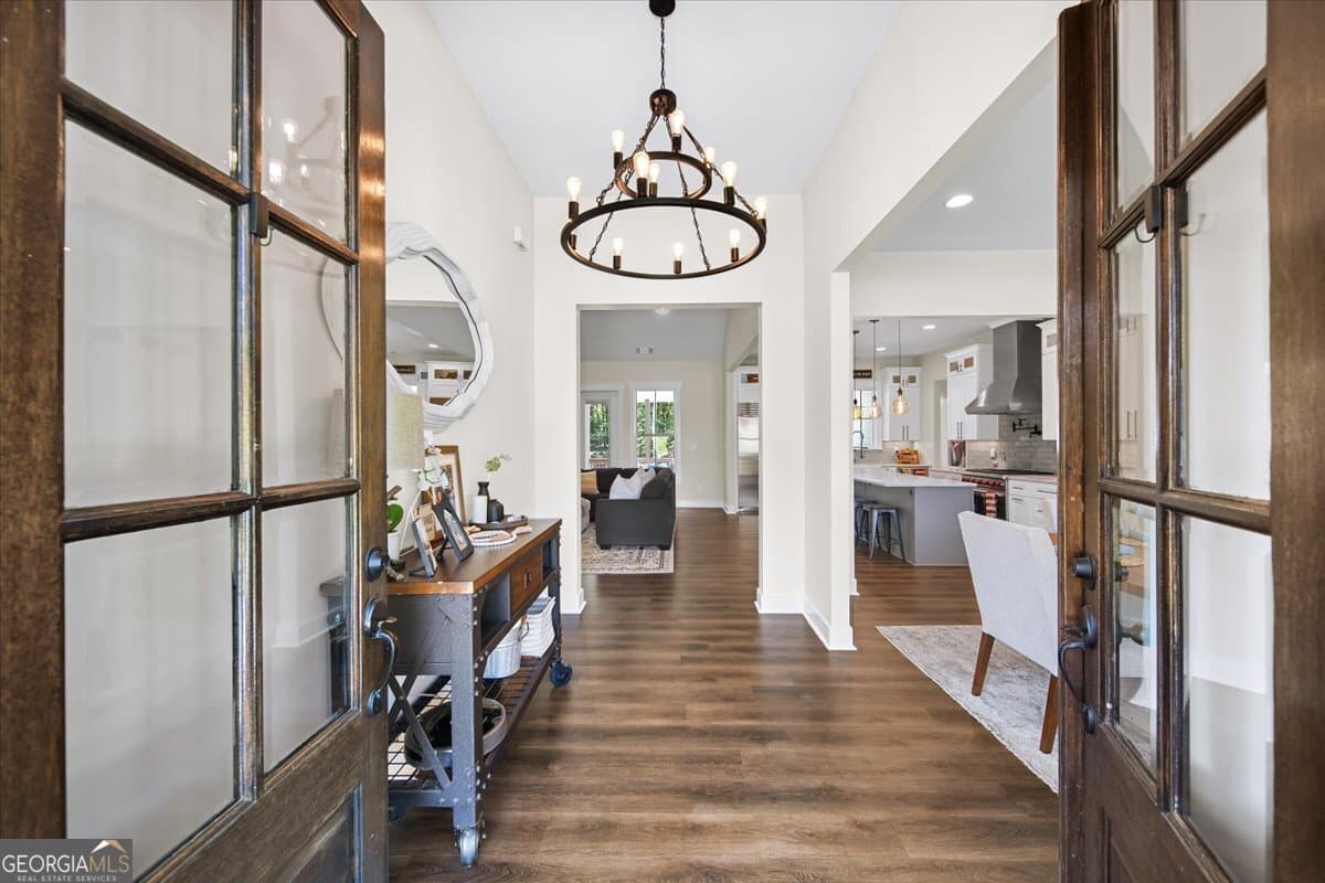 7 bedroom, 5.5 bathroom, 6,399 sq ft single family residence for sale at 1380 Cronic Town Road, Auburn, GA 30011 — photo 10