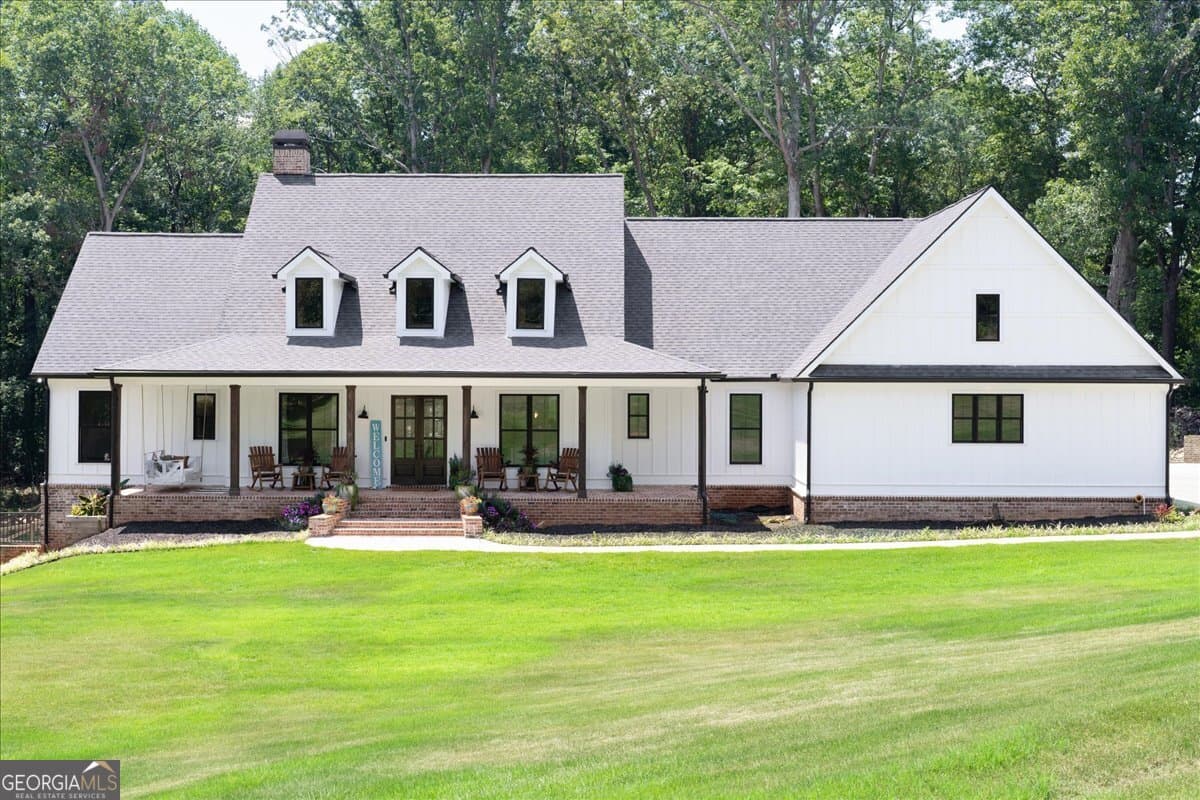 7 bedroom, 5.5 bathroom, 6,399 sq ft single family residence for sale at 1380 Cronic Town Road, Auburn, GA 30011 — photo 8
