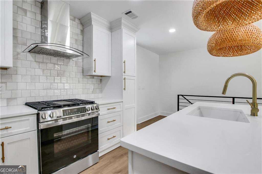 4 bedroom, 3 bathroom single family residence for sale at 1905 Delowe Place, Atlanta, GA 30311 — photo 4