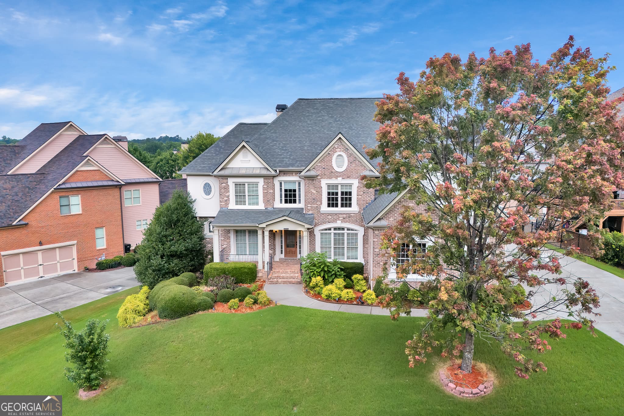 6 bedroom, 5.5 bathroom, 6,489 sq ft single family residence for sale at 2552 Stone Manor Drive, Buford, GA 30519 — photo 1 of 28