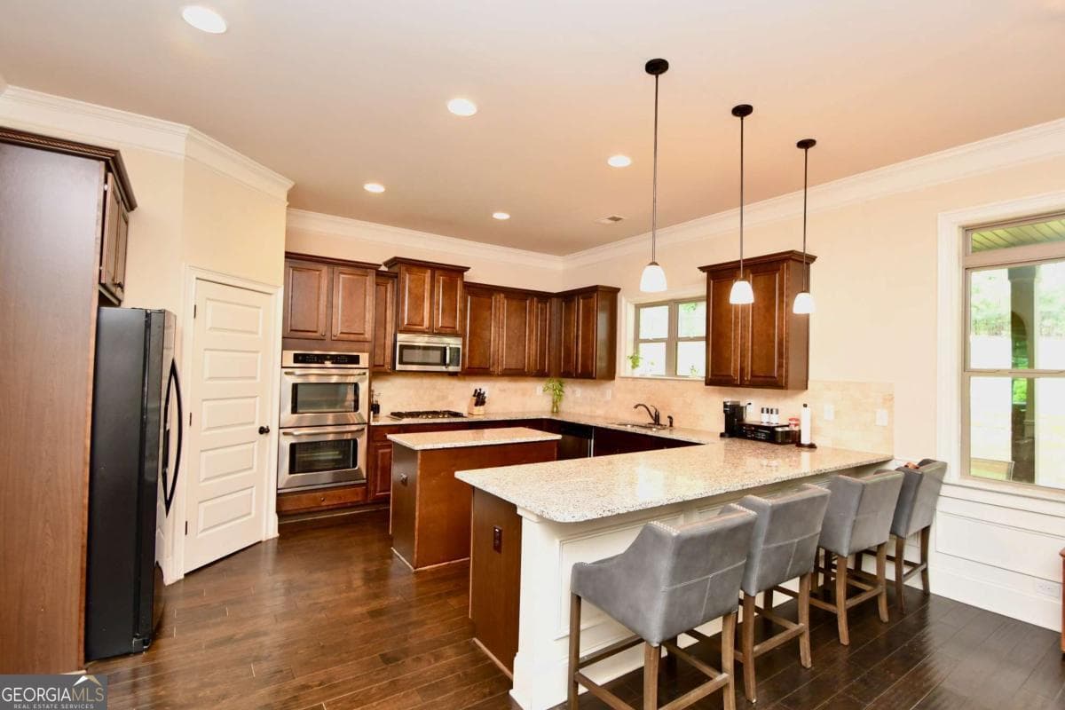 4 bedroom, 2.5 bathroom, 3,846 sq ft single family residence for sale at 1140 Riverhill Drive, Bishop, GA 30621 — photo 5