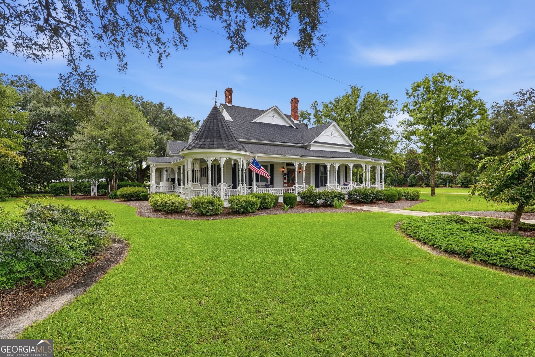4 bedroom, 3.5 bathroom, 3,948 sq ft single family residence for sale at 309 S College Street, Twin City, GA 30471 — photo 2