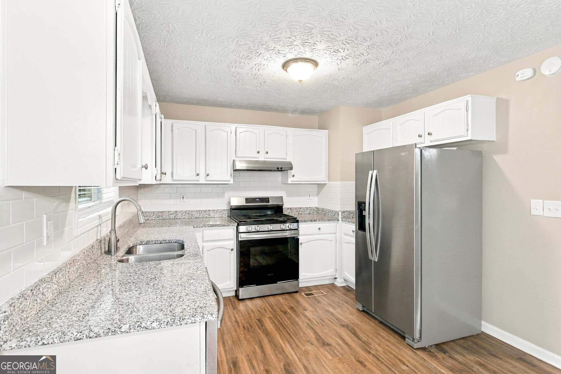 5 bedroom, 2 bathroom, 1,754 sq ft single family residence for sale at 6048 Matthew Lane, Douglasville, GA 30135 — photo 7
