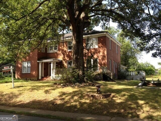 11 bedroom, 4.5 bathroom single family residence for sale at 7047 Swift Street, Lithonia, GA 30058