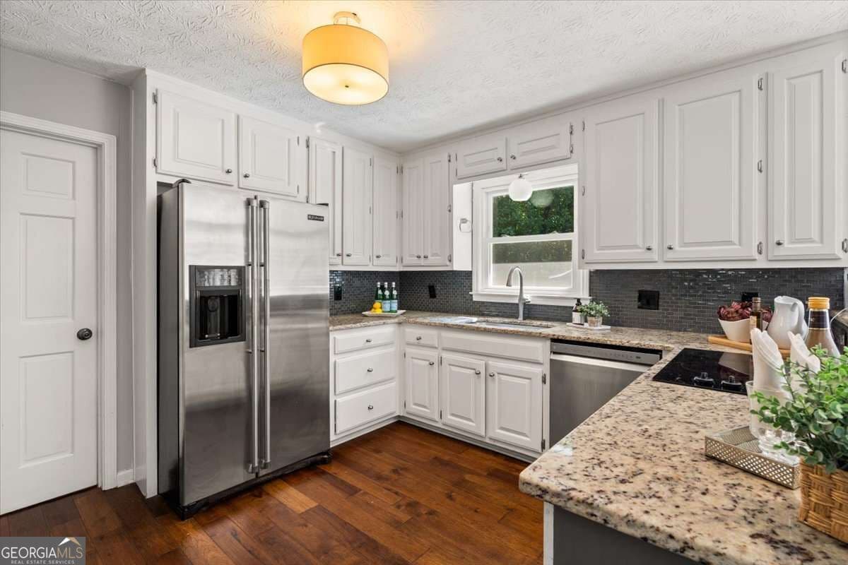 4 bedroom, 2 bathroom, 2,118 sq ft single family residence for sale at 1820 Commonwealth Avenue, Cumming, GA 30041 — photo 4