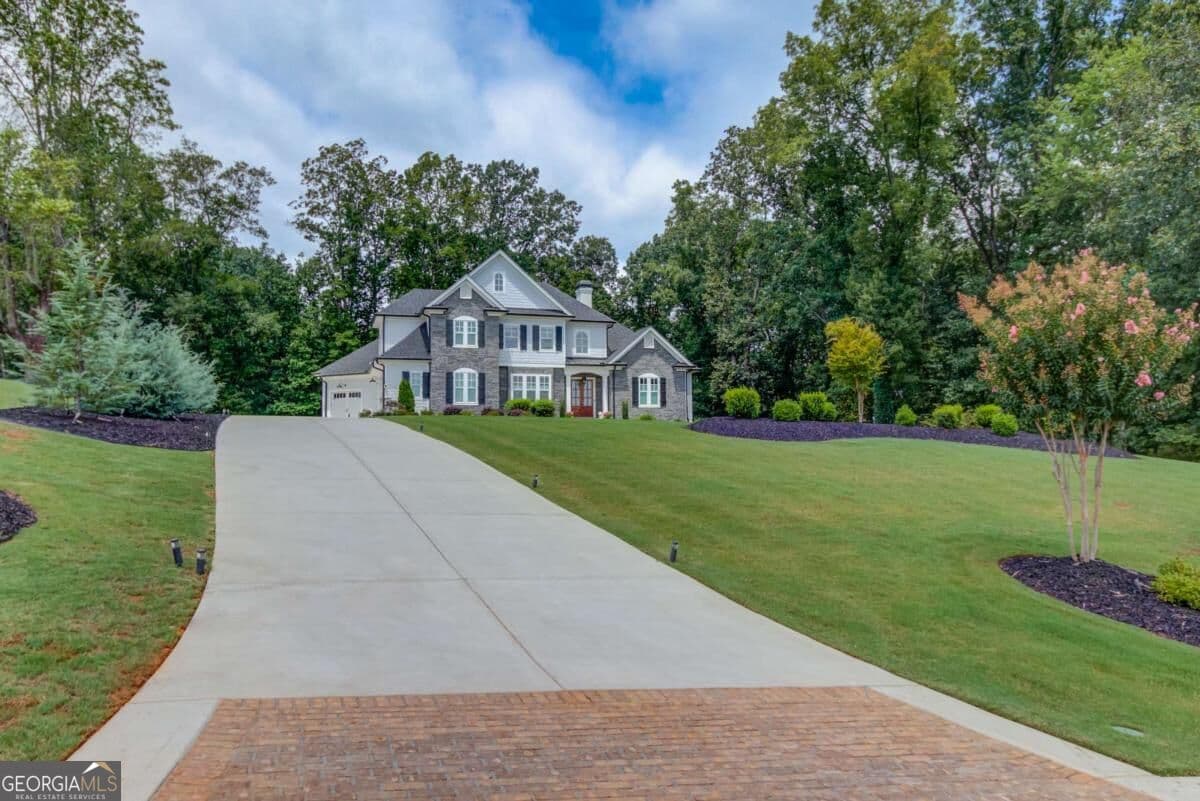 5 bedroom, 4.5 bathroom, 4,742 sq ft single family residence for sale at 5392 Retreat Drive, Flowery Branch, GA 30542 — photo 6