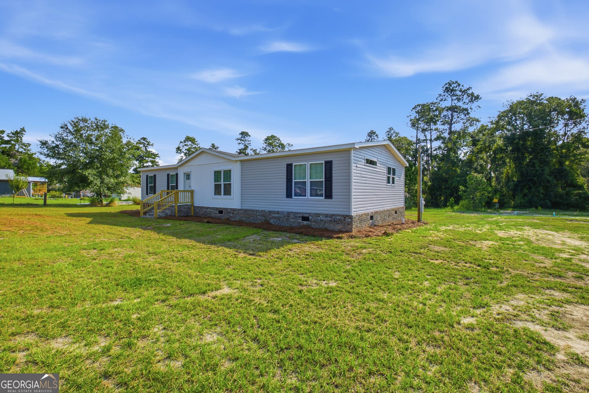 3 bedroom, 2 bathroom, 1,680 sq ft manufactured home,single family residence for sale at 1127 5th Avenue, Twin City, GA 30471 — photo 2