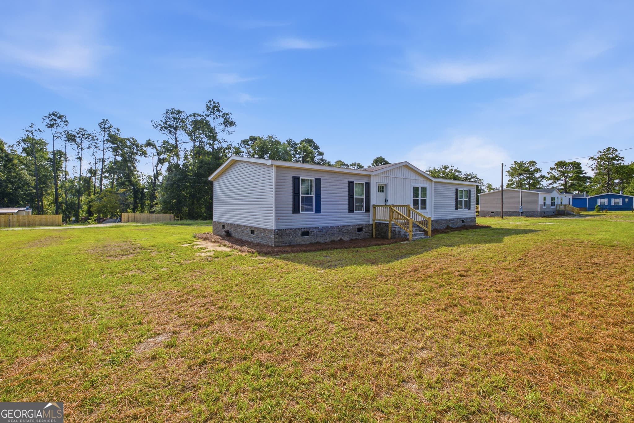 3 bedroom, 2 bathroom, 1,680 sq ft manufactured home,single family residence for sale at 1127 5th Avenue, Twin City, GA 30471 — photo 3