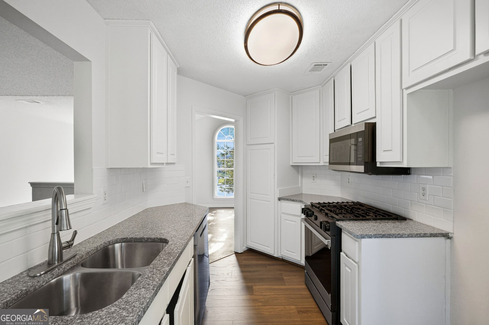 4 bedroom, 2.5 bathroom, 2,080 sq ft single family residence for sale at 5129 Buchli Crest Court, Lithonia, GA 30038 — photo 2