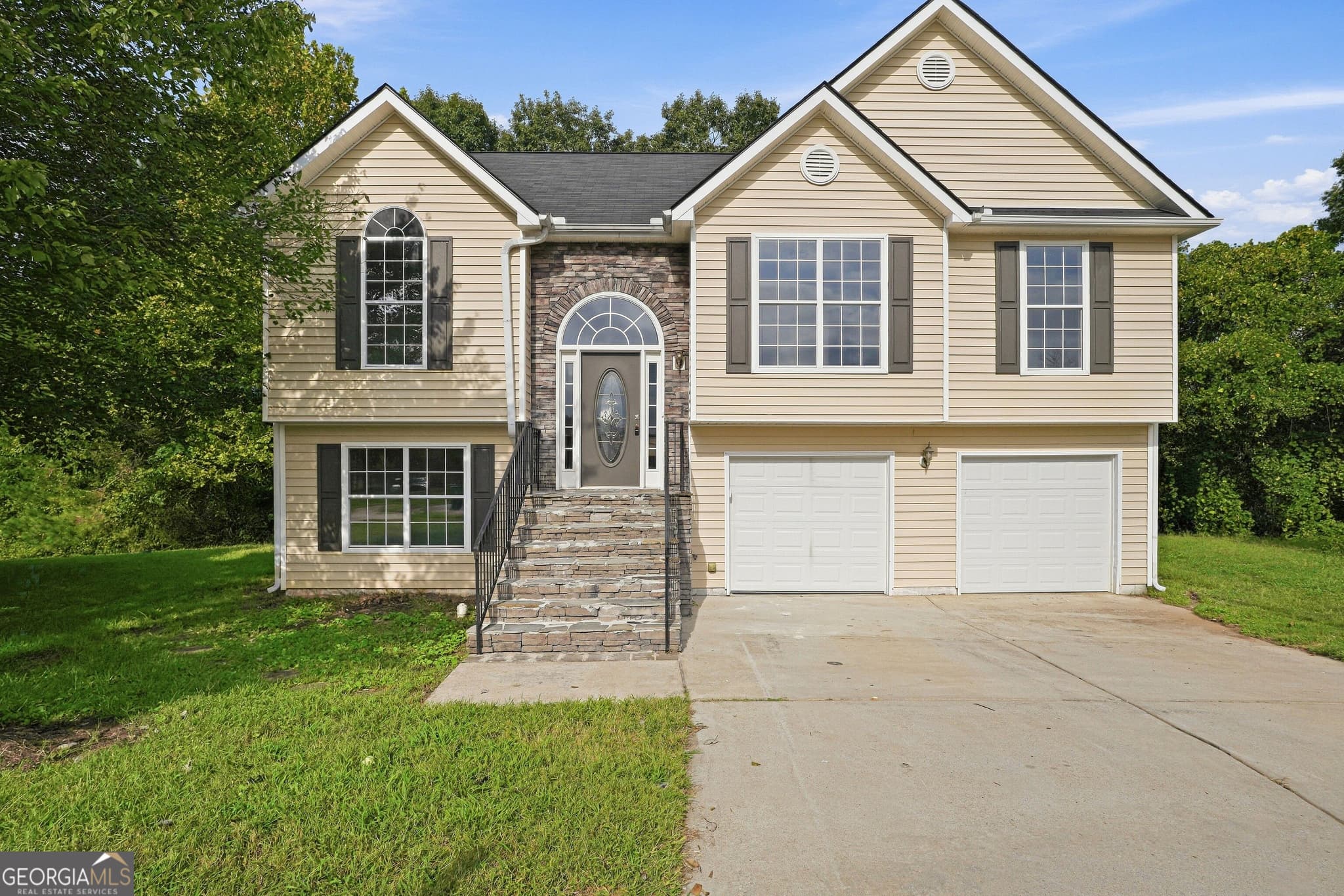 4 bedroom, 2.5 bathroom, 2,080 sq ft single family residence for sale at 5129 Buchli Crest Court, Lithonia, GA 30038 — photo 1 of 34