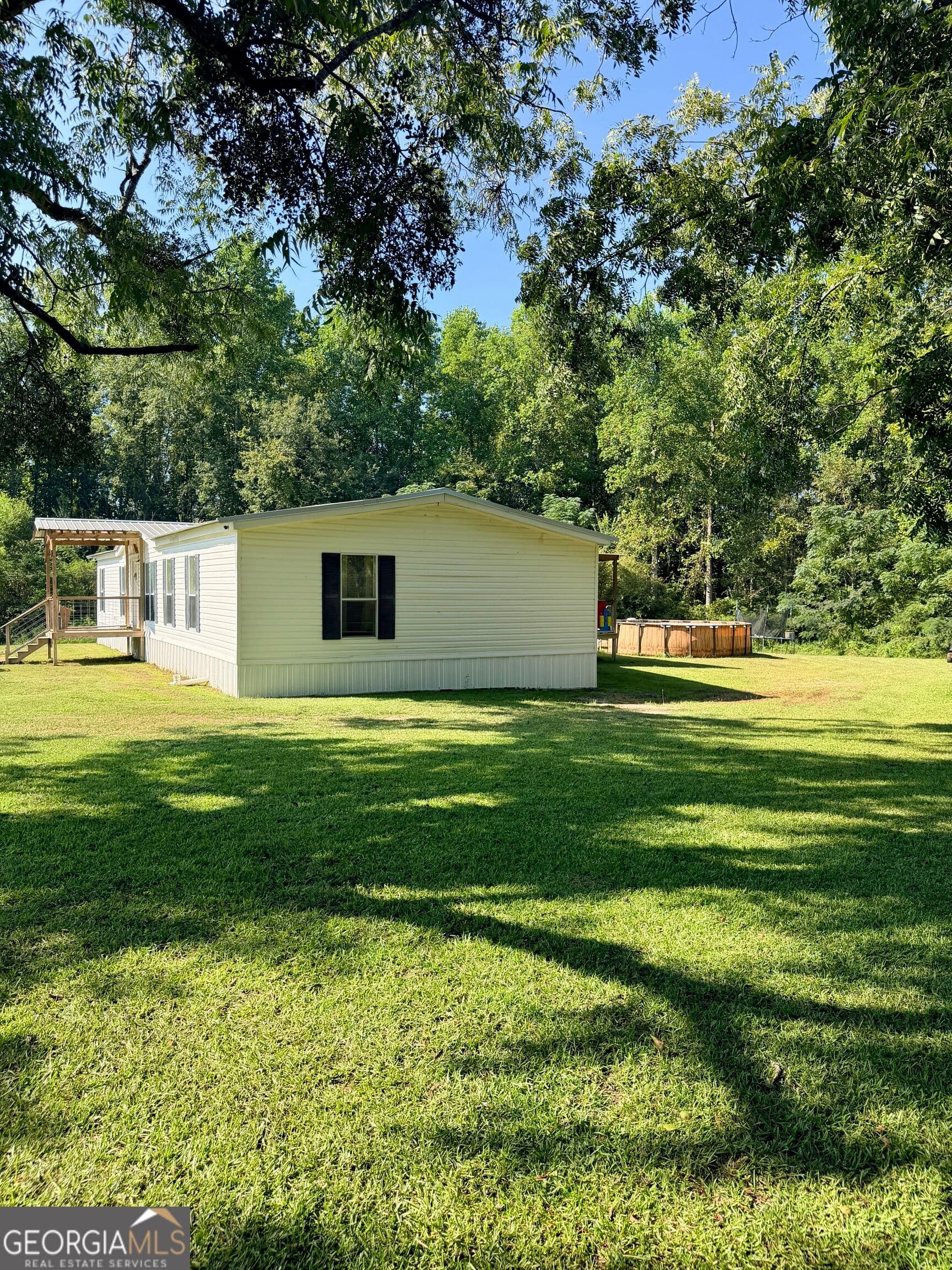 4 bedroom, 2 bathroom, 2,052 sq ft manufactured home,single family residence for sale at 17979 Kermit Road, Metter, GA 30439 — photo 5