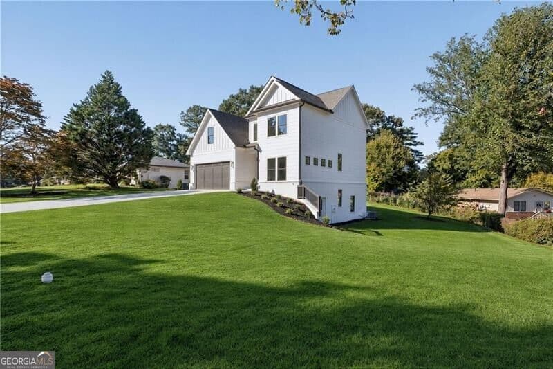 4 bedroom, 3.5 bathroom, 2,439 sq ft single family residence for sale at 2425 Elmwood Circle, Atlanta, GA 30339 — photo 2