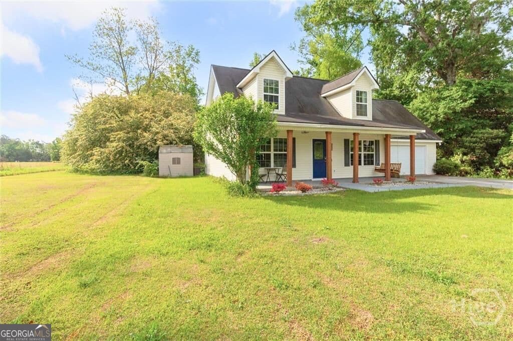 3 bedroom, 2.5 bathroom, 1,563 sq ft single family residence for sale at 2575 Hwy 119, Guyton, GA 31312 — photo 2