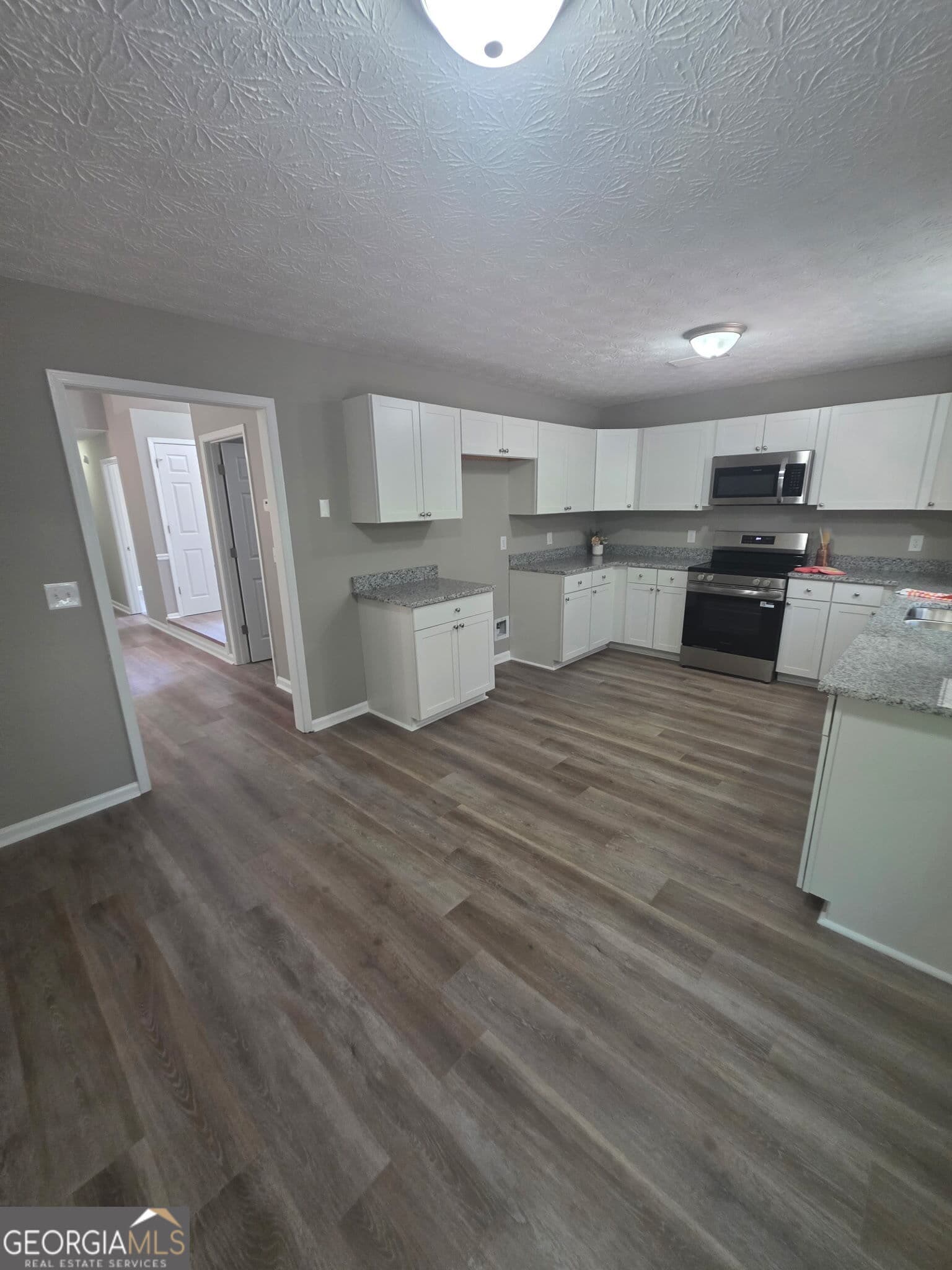 4 bedroom, 2 bathroom, 1,625 sq ft single family residence for sale at 3555 Irvin Drive, Loganville, GA 30052 — photo 5
