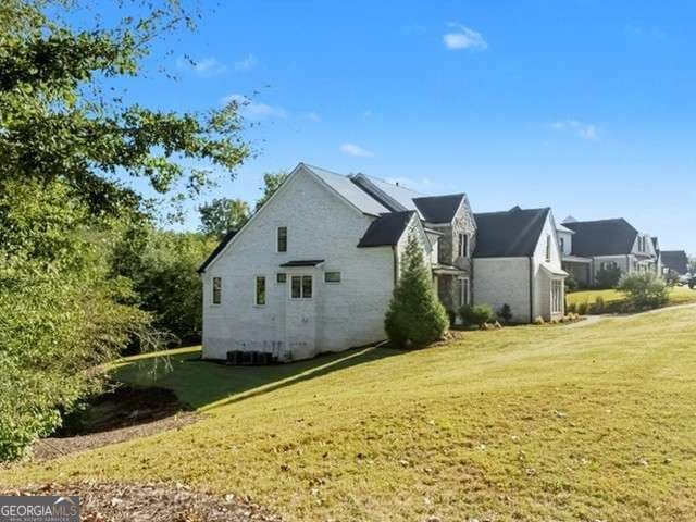 6 bedroom, 5.5 bathroom, 6,468 sq ft single family residence for sale at 5760 Lula Bridge Court, Braselton, GA 30517 — photo 3