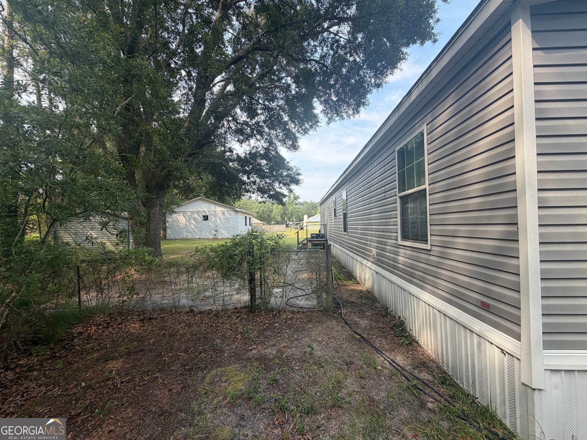 3 bedroom, 2 bathroom, 1,431 sq ft manufactured home,single family residence for sale at 135 Stafford Road, Brunswick, GA 31523 — photo 4