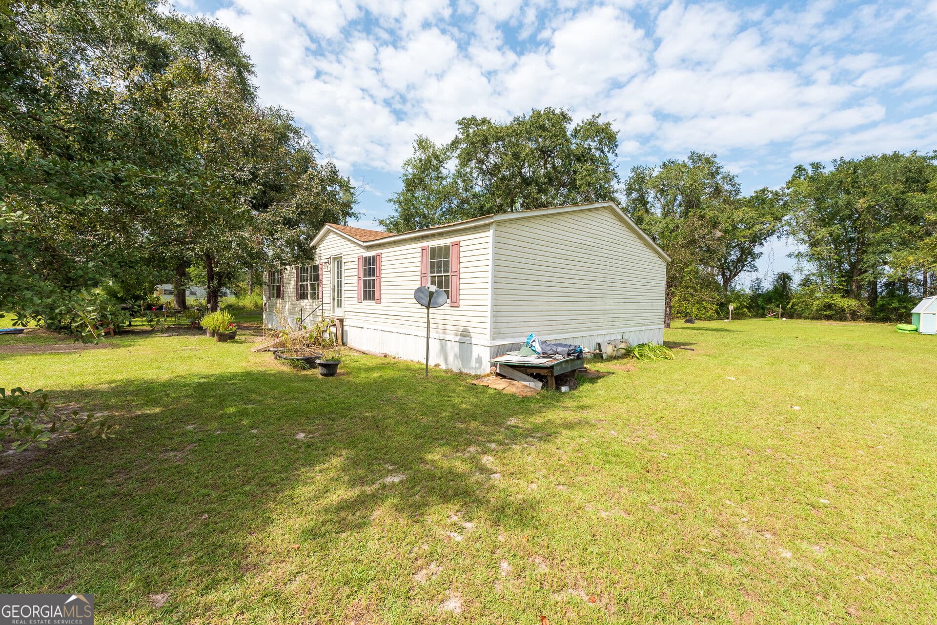 4 bedroom, 2 bathroom, 1,560 sq ft manufactured home,single family residence for sale at 569 Shady Oaks Circle, Hoboken, GA 31542 — photo 6