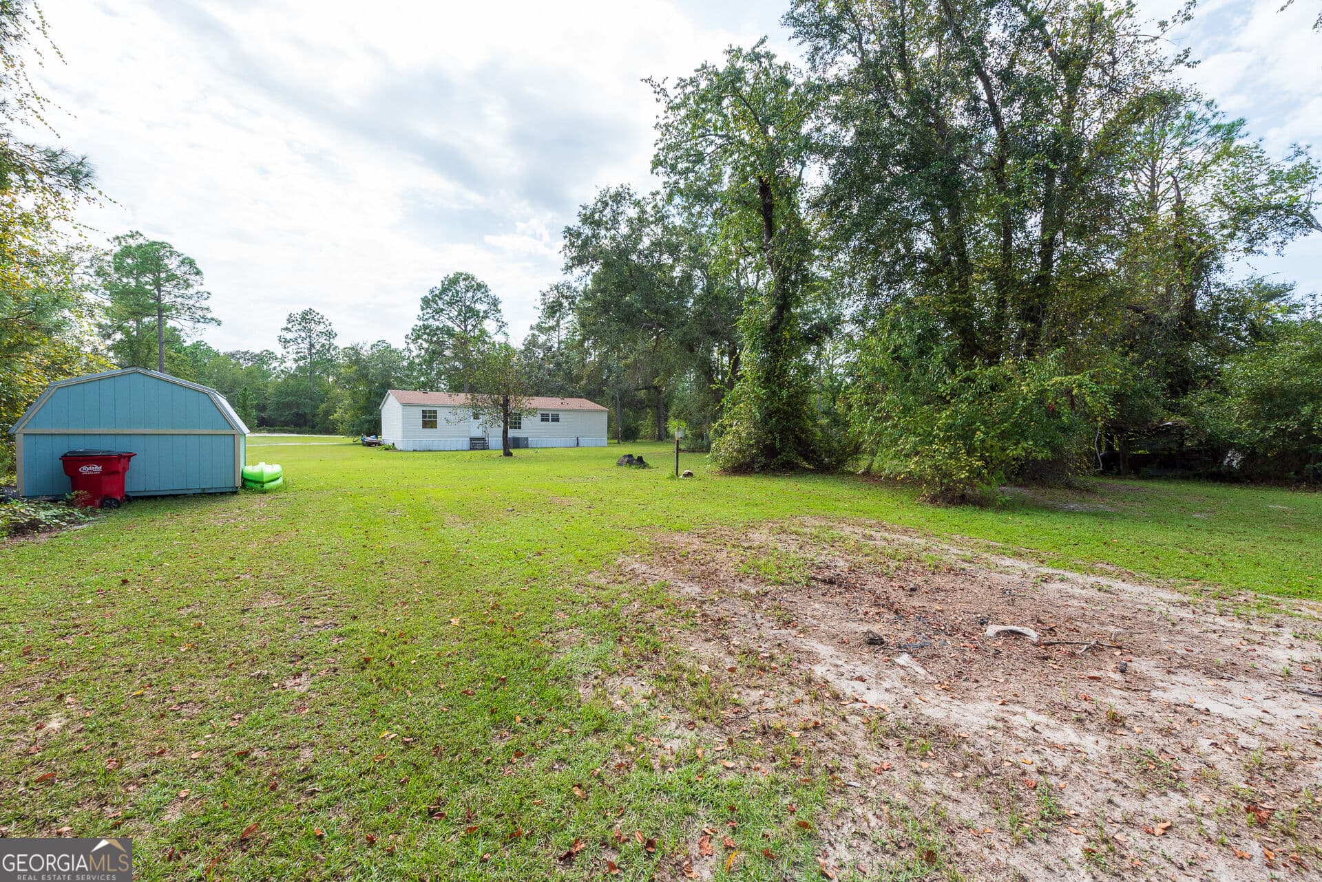 4 bedroom, 2 bathroom, 1,560 sq ft manufactured home,single family residence for sale at 569 Shady Oaks Circle, Hoboken, GA 31542 — photo 9