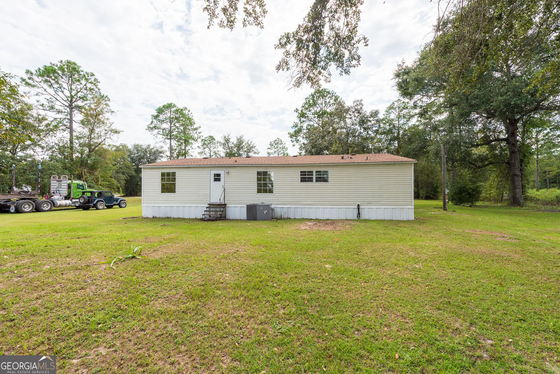 4 bedroom, 2 bathroom, 1,560 sq ft manufactured home,single family residence for sale at 569 Shady Oaks Circle, Hoboken, GA 31542 — photo 4