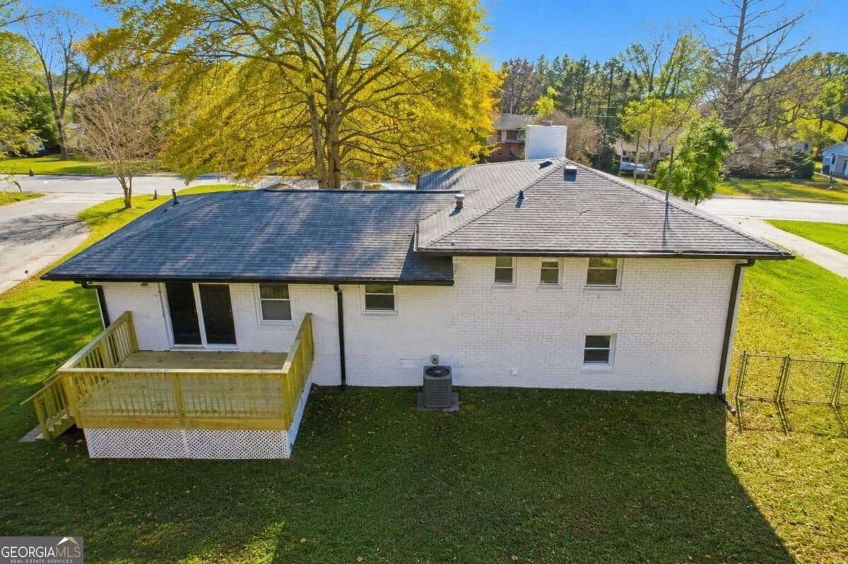 4 bedroom, 2 bathroom, 1,350 sq ft single family residence for sale at 4675 Lincoln Way, Lilburn, GA 30047 — photo 4