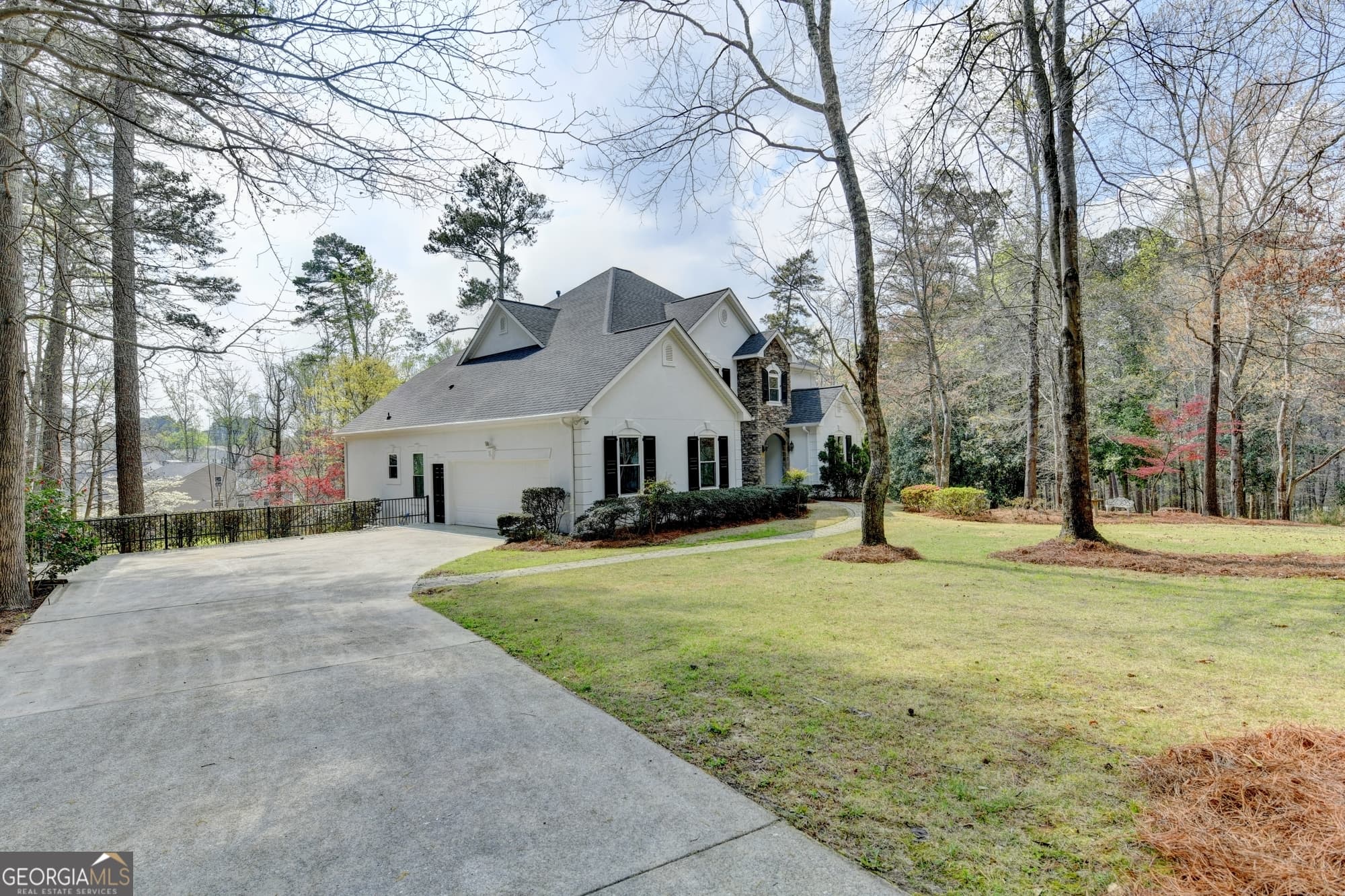 4 bedroom, 4 bathroom, 5,178 sq ft single family residence for sale at 6336 Old Shadburn Ferry Road, Buford, GA 30518 — photo 2