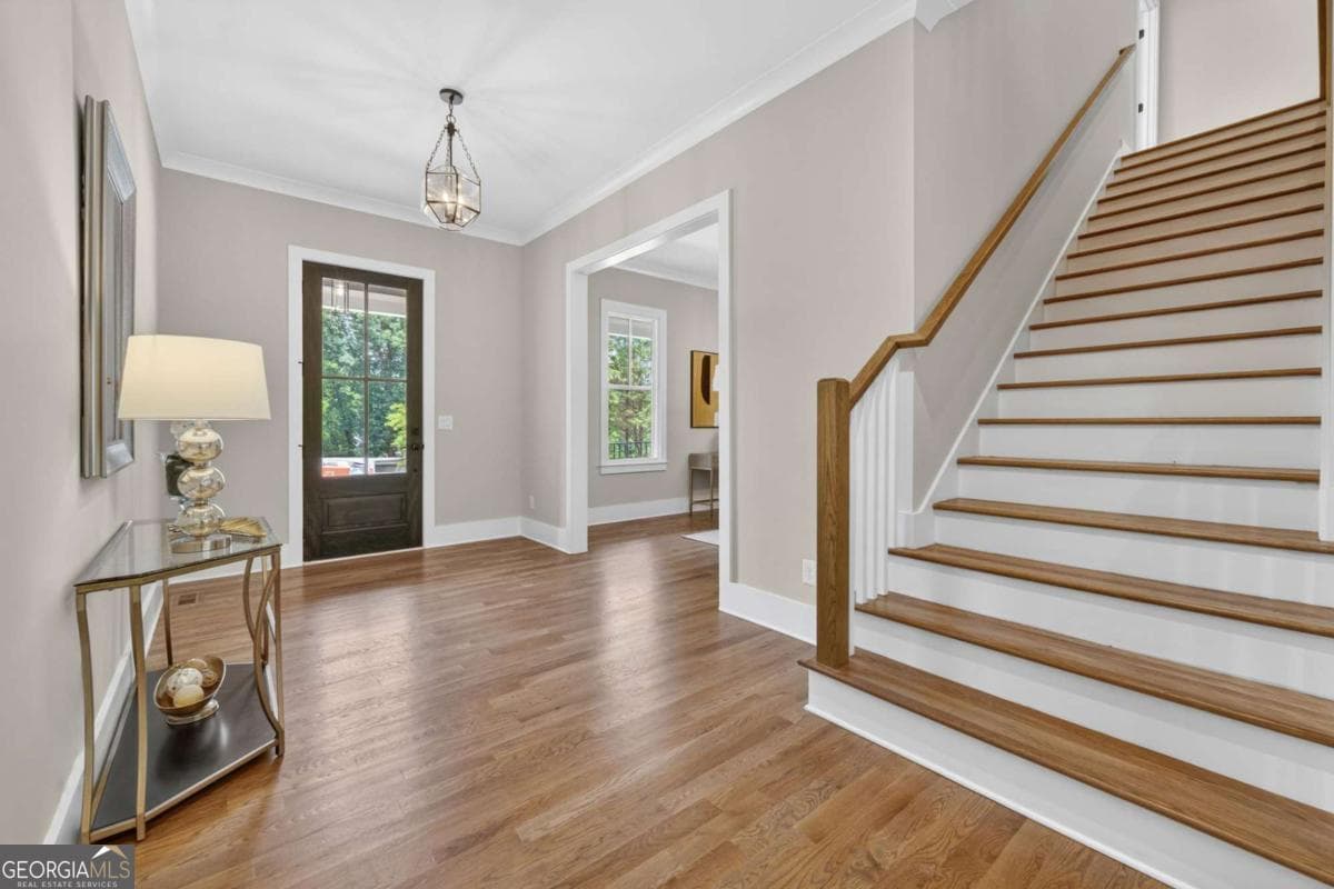 4 bedroom, 5.5 bathroom, 5,800 sq ft single family residence for sale at 7620 Breeze Bay Road, Cumming, GA 30041 — photo 3