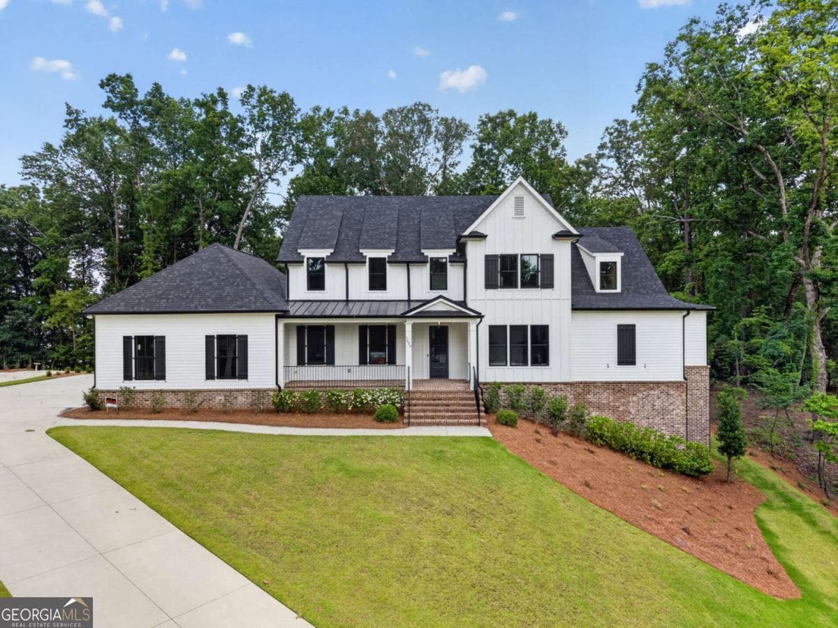 4 bedroom, 5.5 bathroom, 5,800 sq ft single family residence for sale at 7620 Breeze Bay Road, Cumming, GA 30041