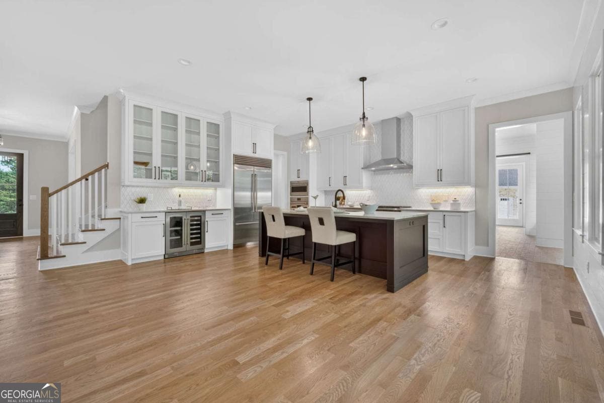 4 bedroom, 5.5 bathroom, 5,800 sq ft single family residence for sale at 7620 Breeze Bay Road, Cumming, GA 30041 — photo 10