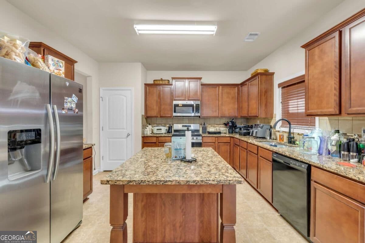 4 bedroom, 2.5 bathroom single family residence for sale at 7736 Old Thyme Road, Union City, GA 30291 — photo 4