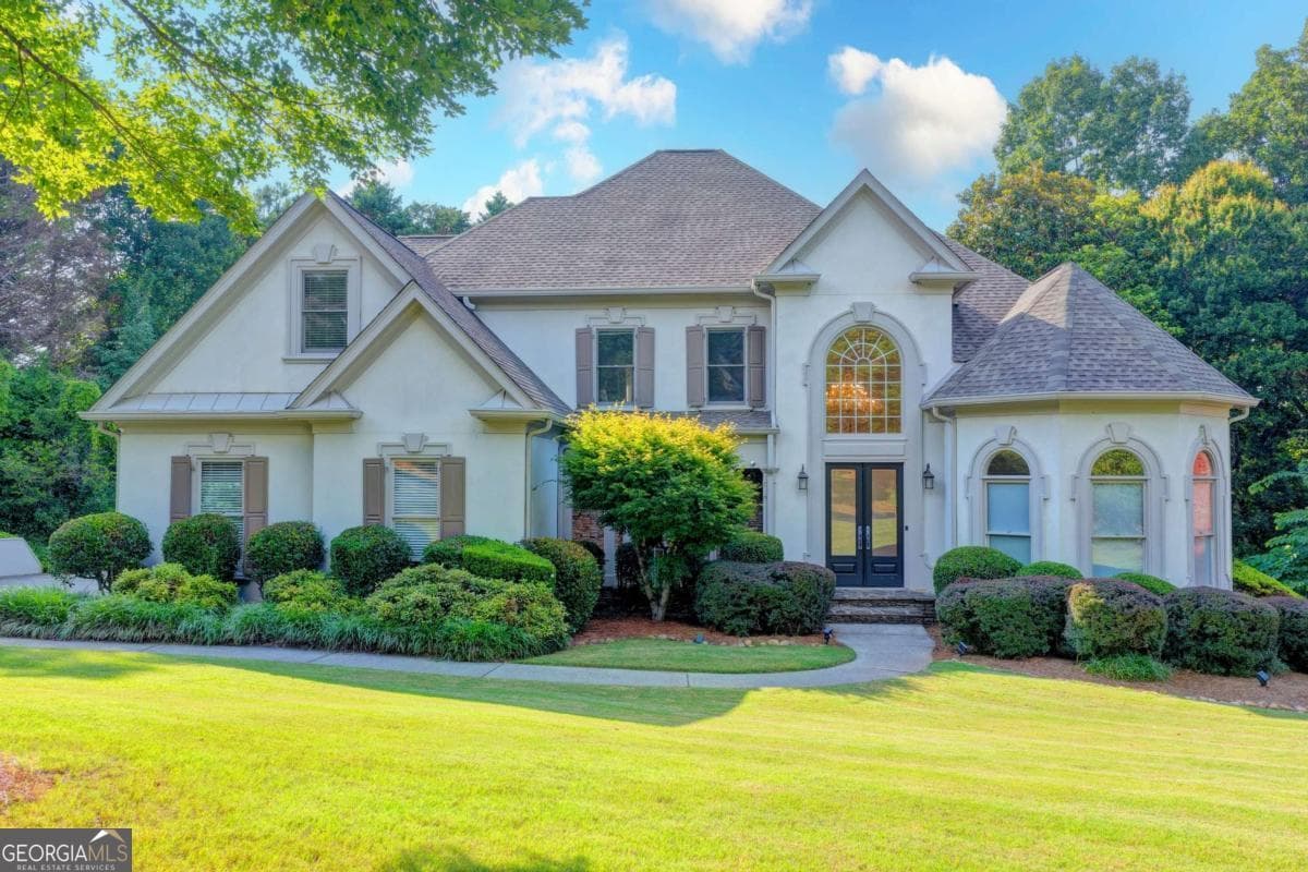 6 bedroom, 4.5 bathroom, 4,600 sq ft single family residence sold at 5955 Ettington Drive, Suwanee, GA 30024