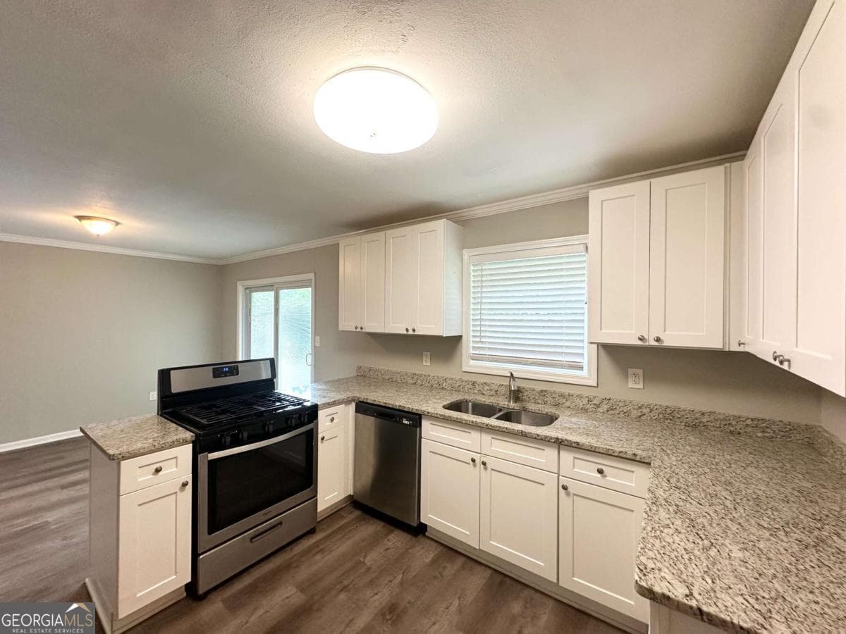 4 bedroom, 2 bathroom, 1,300 sq ft single family residence for sale at 3948 Regent Street, Douglasville, GA 30134 — photo 2