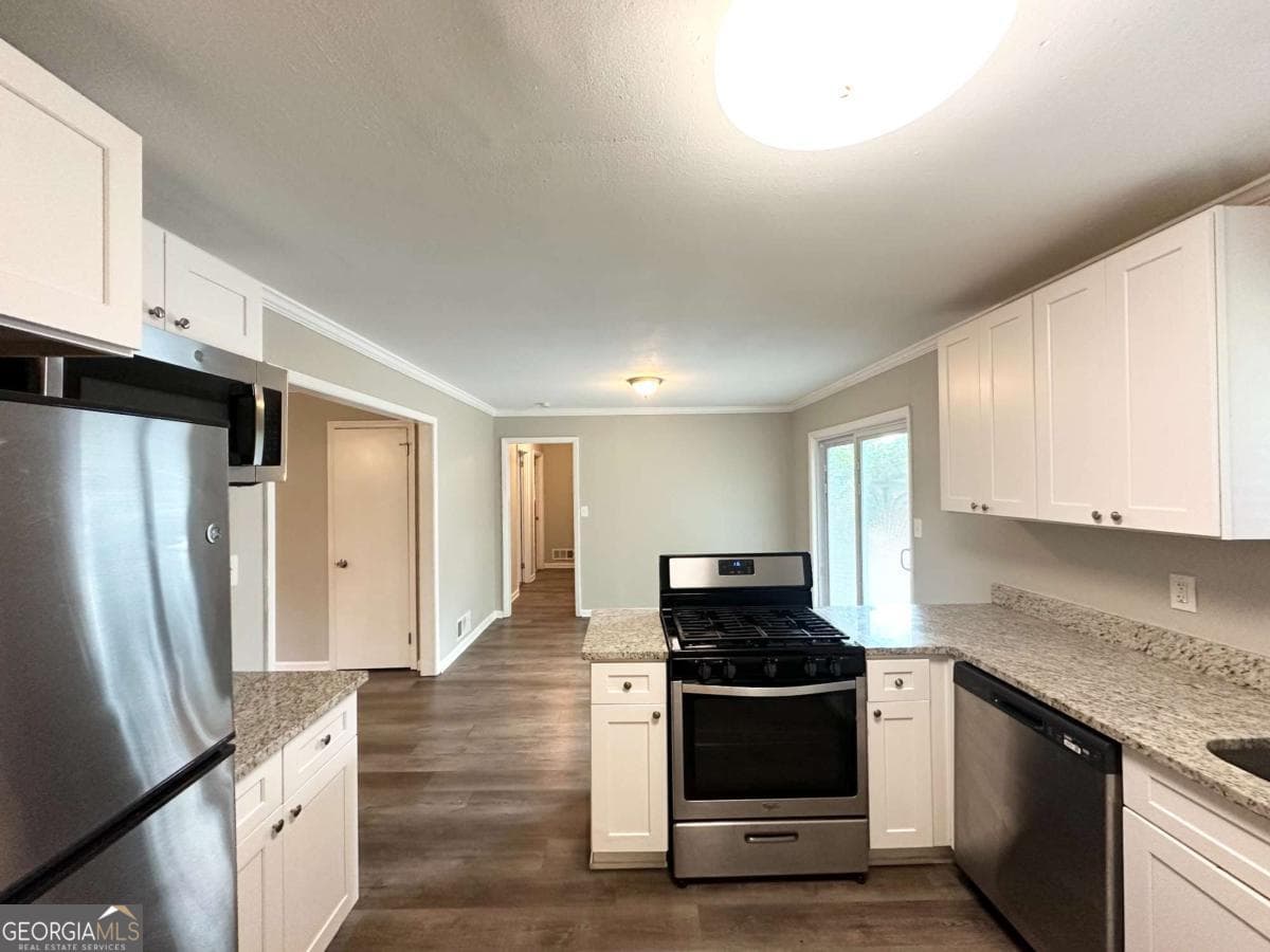 4 bedroom, 2 bathroom, 1,300 sq ft single family residence for sale at 3948 Regent Street, Douglasville, GA 30134 — photo 4
