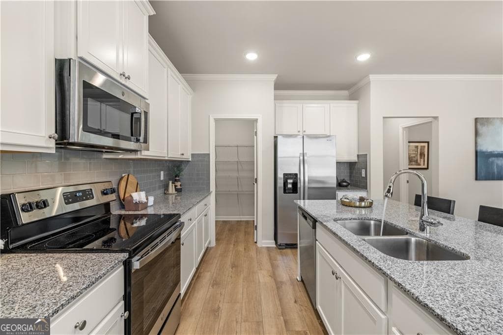 4 bedroom, 2.5 bathroom, 2,506 sq ft single family residence for sale at 211 Whispering Pines Avenue LOT 163, Conyers, GA 30094 — photo 6