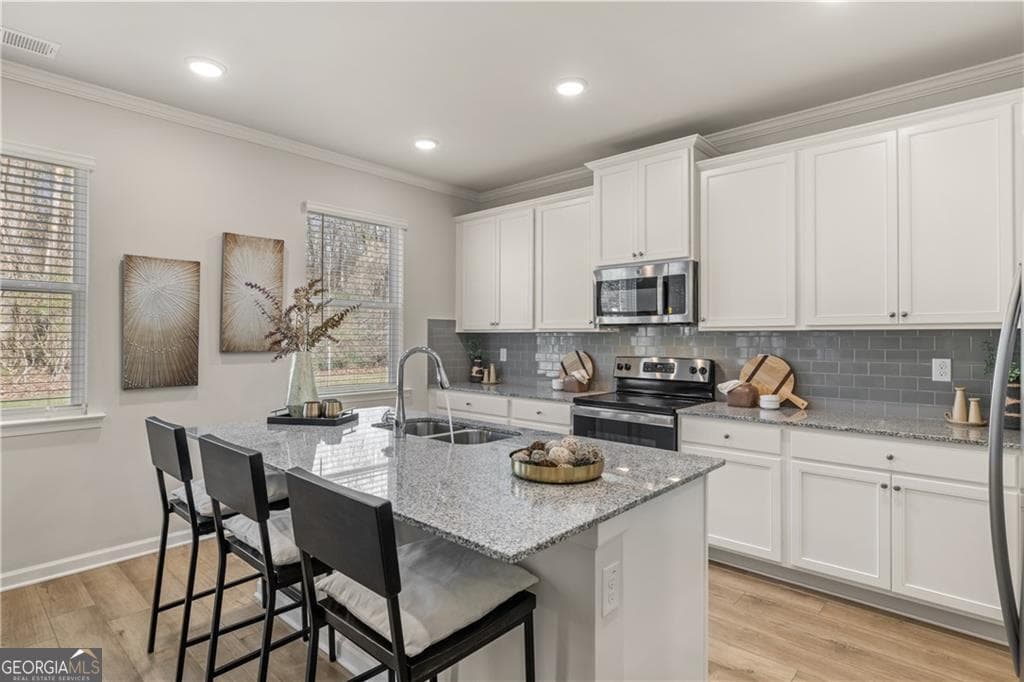 4 bedroom, 2.5 bathroom, 2,506 sq ft single family residence for sale at 211 Whispering Pines Avenue LOT 163, Conyers, GA 30094 — photo 4