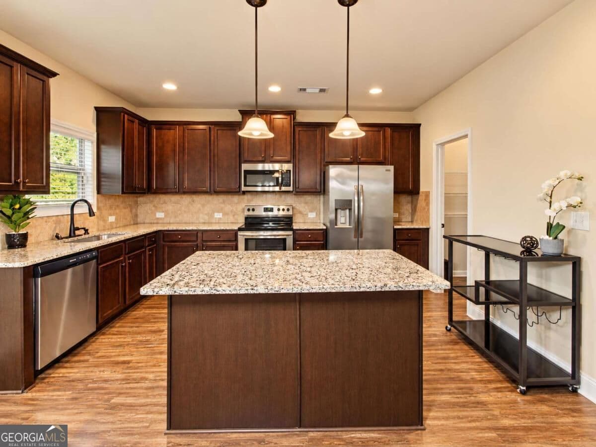 4 bedroom, 2.5 bathroom, 2,265 sq ft single family residence for sale at 6055 Prodigy Lane, Locust Grove, GA 30248 — photo 6