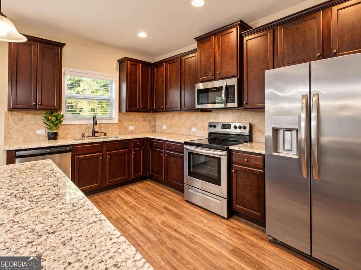 4 bedroom, 2.5 bathroom, 2,265 sq ft single family residence for sale at 6055 Prodigy Lane, Locust Grove, GA 30248 — photo 7