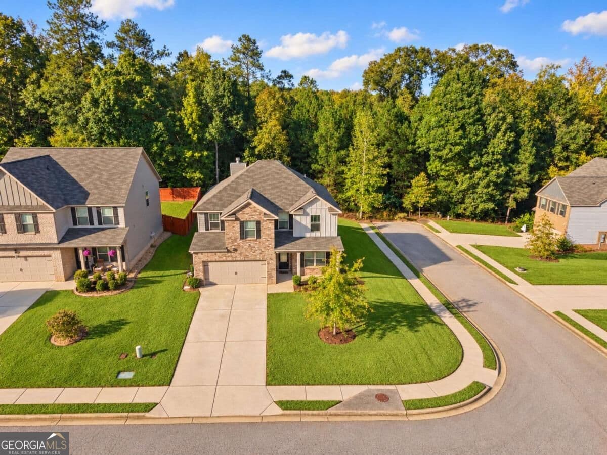 4 bedroom, 2.5 bathroom, 2,265 sq ft single family residence for sale at 6055 Prodigy Lane, Locust Grove, GA 30248 — photo 1 of 35