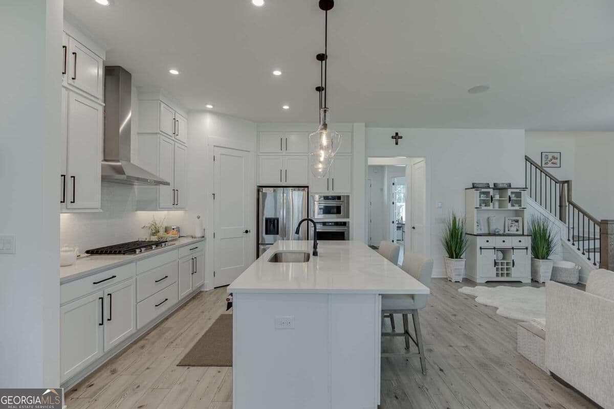 5 bedroom, 4.5 bathroom, 3,485 sq ft single family residence for sale at 2570 Bertrand Way, Cumming, GA 30041 — photo 3