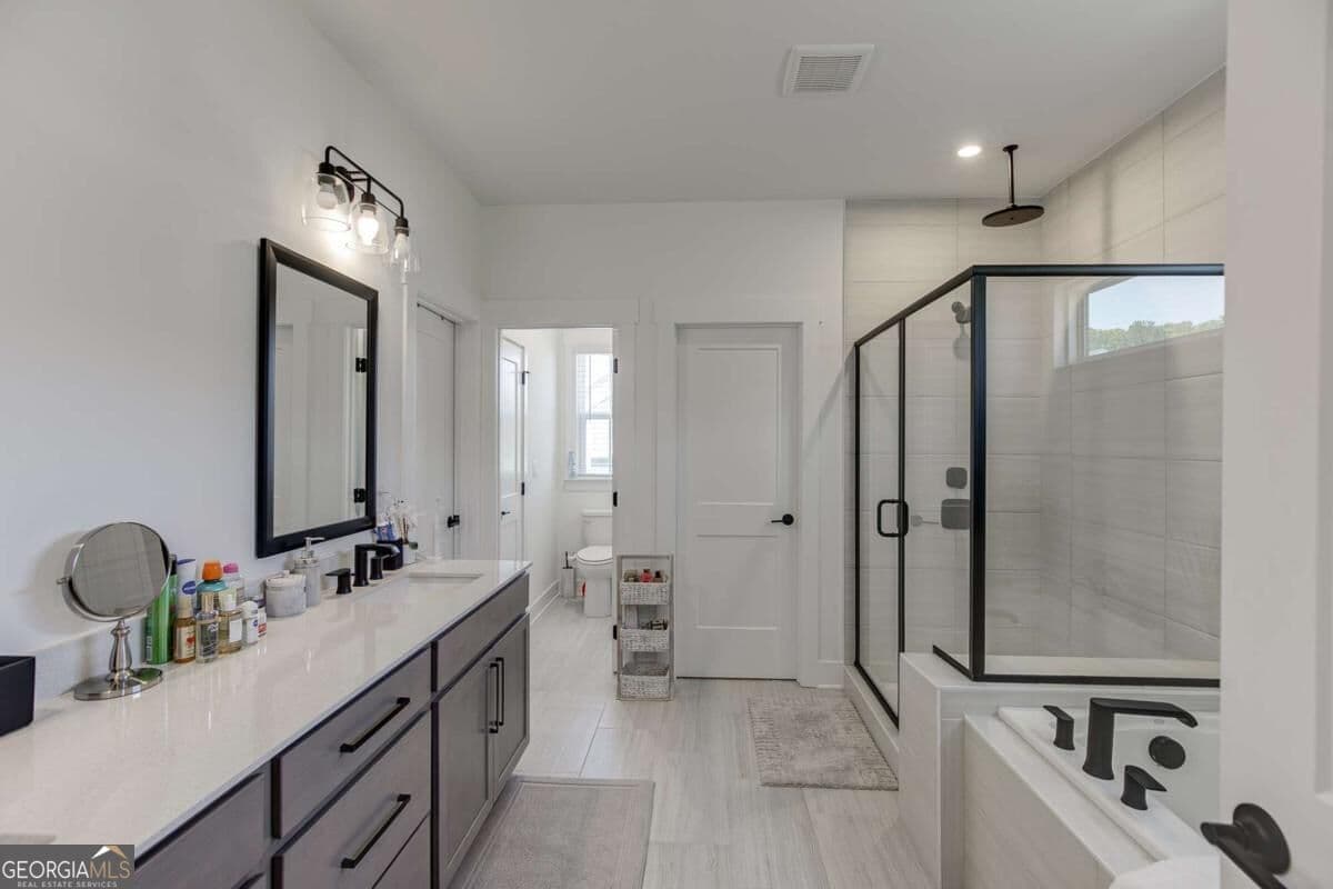 5 bedroom, 4.5 bathroom, 3,485 sq ft single family residence for sale at 2570 Bertrand Way, Cumming, GA 30041 — photo 10