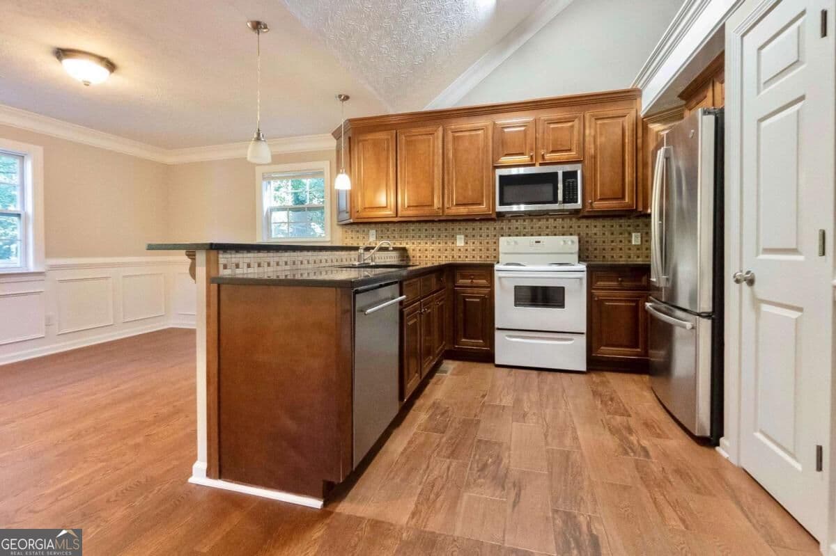 4 bedroom, 3 bathroom single family residence for sale at 5507 Riverside Drive, Sugar Hill, GA 30518 — photo 4