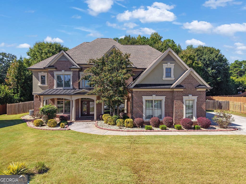 5 bedroom, 4.5 bathroom, 4,873 sq ft single family residence for sale at 5127 Bentwater Lane, Lilburn, GA 30047 — photo 2