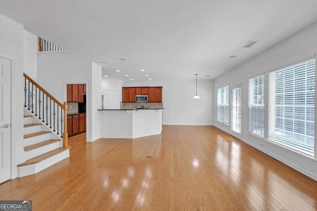 5 bedroom, 3 bathroom, 2,472 sq ft single family residence for sale at 5608 Avonley Creek Drive, Sugar Hill, GA 30518 — photo 6