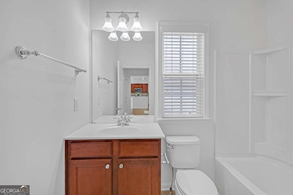 5 bedroom, 3 bathroom, 2,472 sq ft single family residence for sale at 5608 Avonley Creek Drive, Sugar Hill, GA 30518 — photo 9