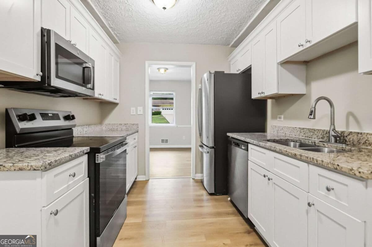 4 bedroom, 2 bathroom, 1,478 sq ft single family residence for sale at 2434 Shamrock Drive, Decatur, GA 30032 — photo 9