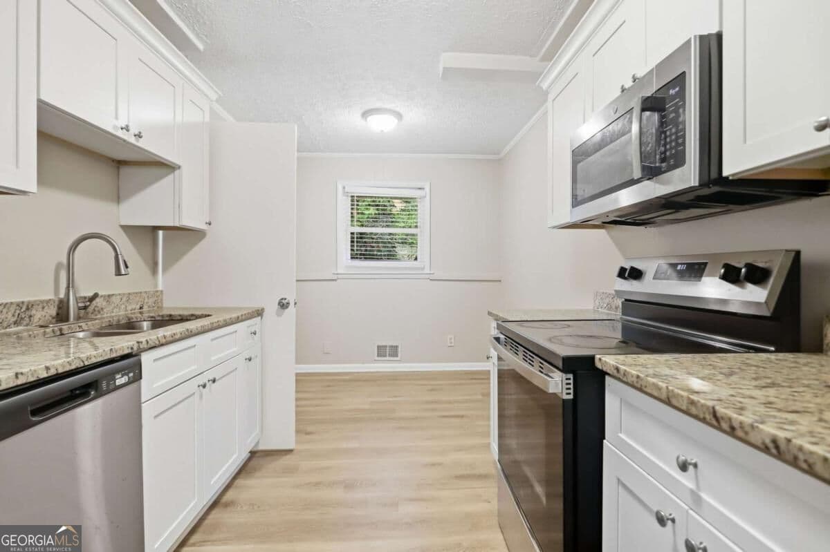 4 bedroom, 2 bathroom, 1,478 sq ft single family residence for sale at 2434 Shamrock Drive, Decatur, GA 30032 — photo 8