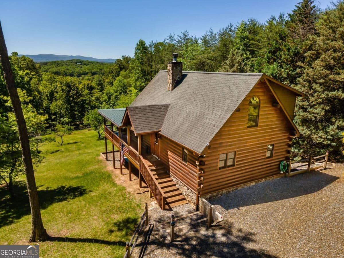 4 bedroom, 3 bathroom, 2,400 sq ft cabin,loft,single family residence for sale at 229 Old Mill Pond Road, Mineral Bluff, GA 30559 — photo 2